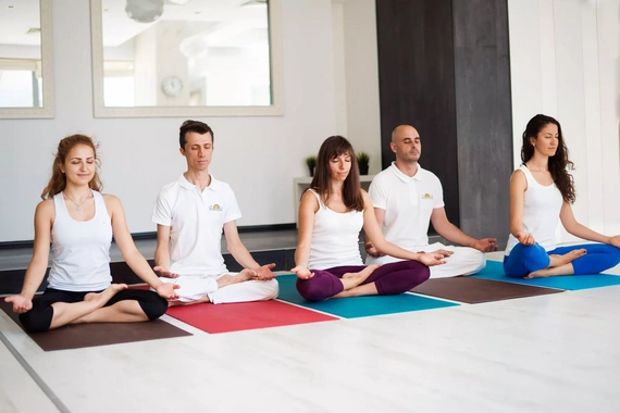 Group of people practicing meditation